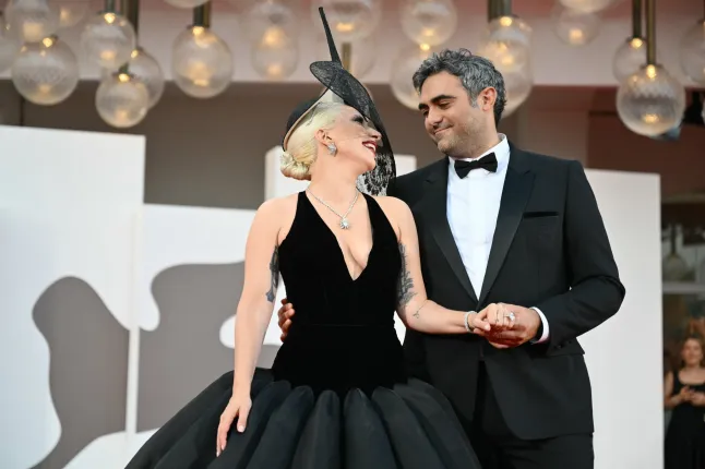 (FILES) L'actrice et chanteuse Lady Gaga et Michael Polansky assistent au tapis rouge du film 